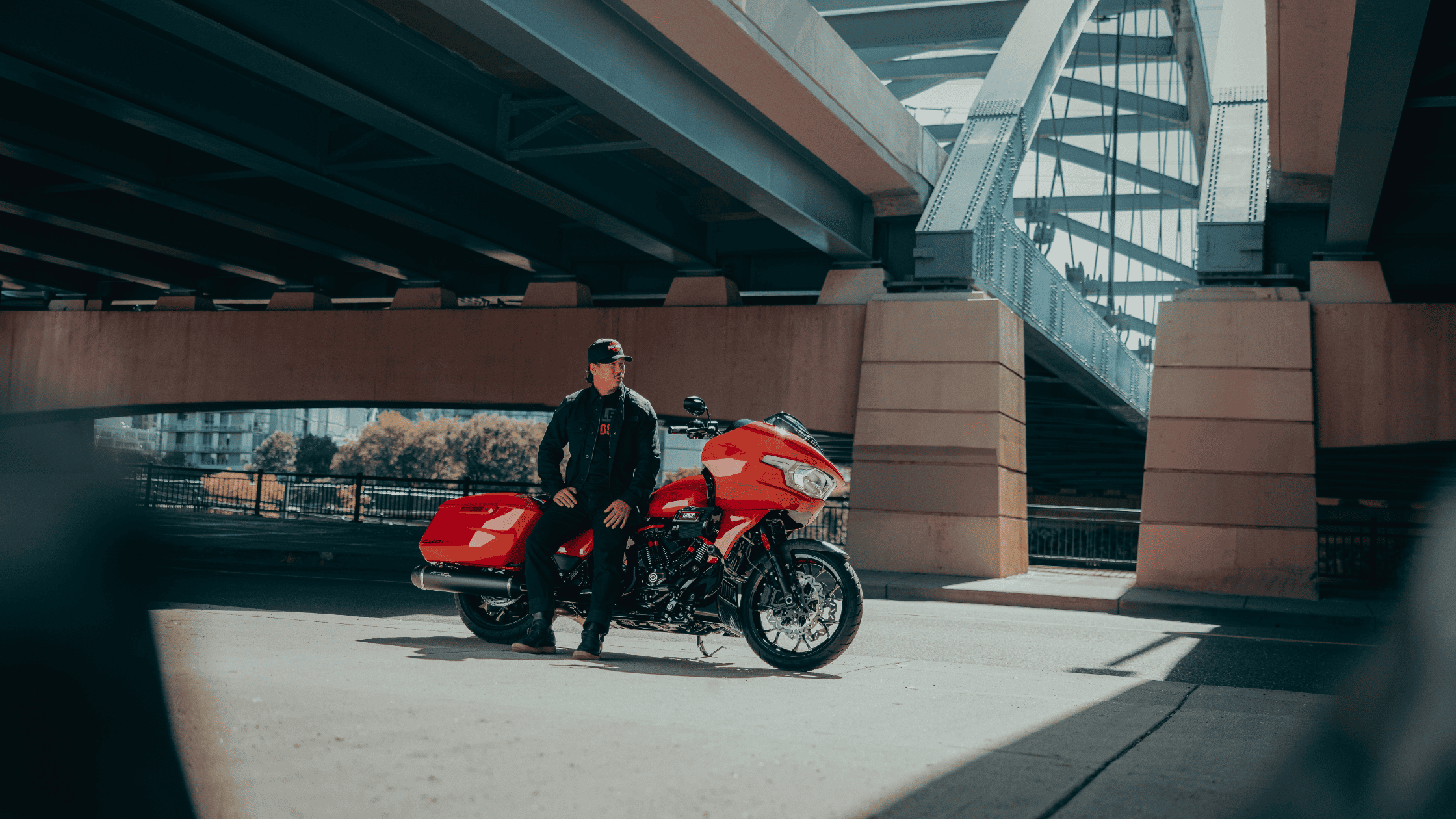 A man on a 2025 Harley-Davidson® CVO™ Road Glide® ST motorcycle, parked in Friendswood, TX.