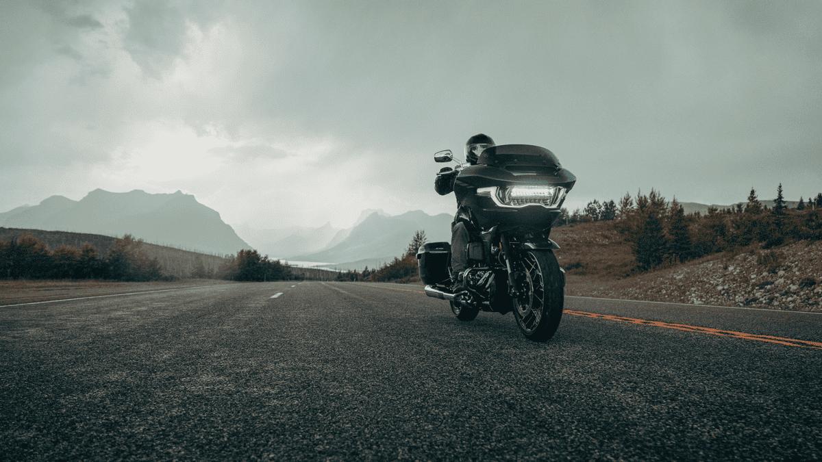 2025 Harley-Davidson® CVO™ Road Glide® riding through mountain highway near Friendswood, TX, built for touring power and comfort.