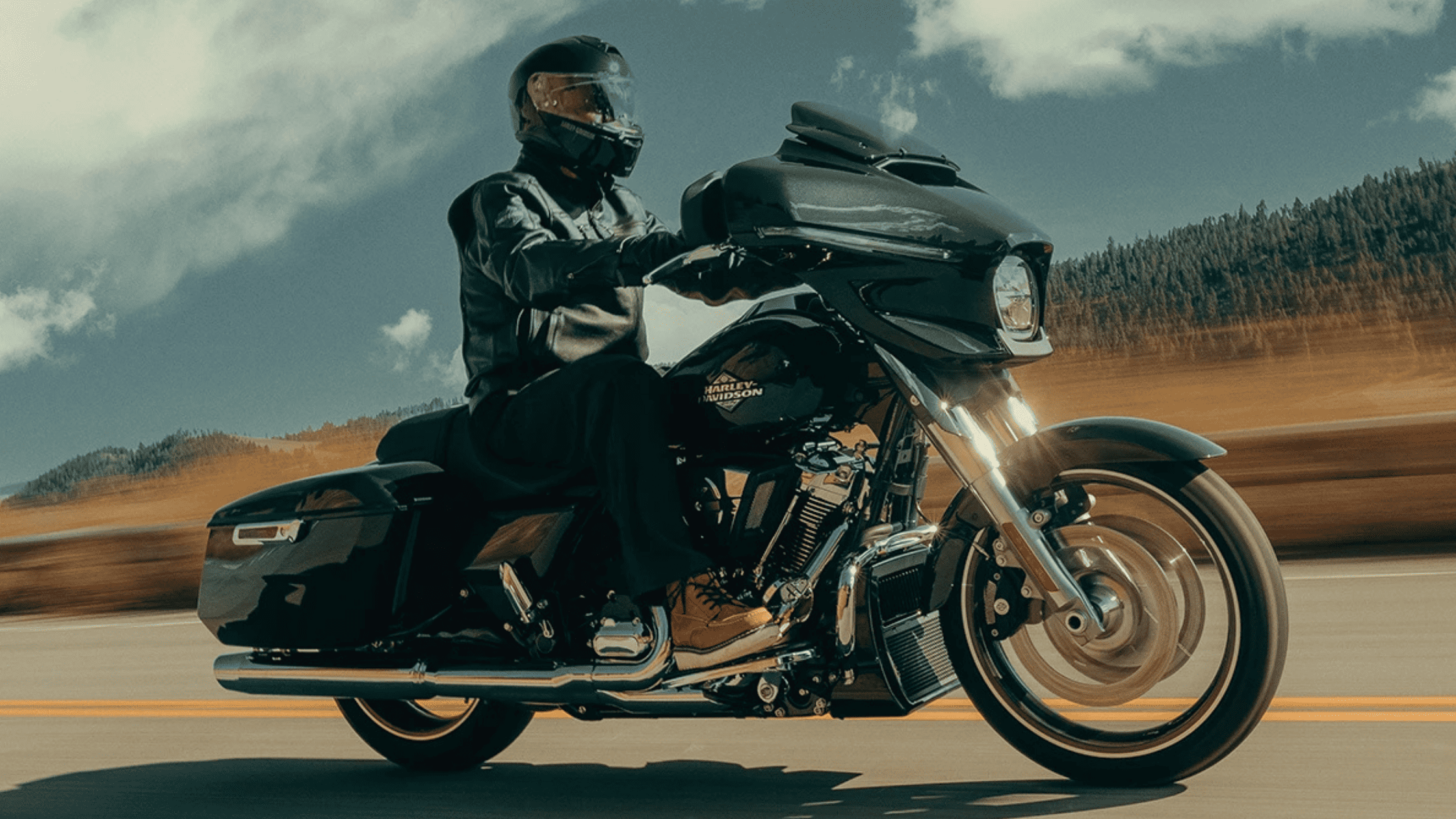 2025 Harley-Davidson® CVO™ Street Glide® cruising near Friendswood, TX, featuring premium design & performance upgrades.