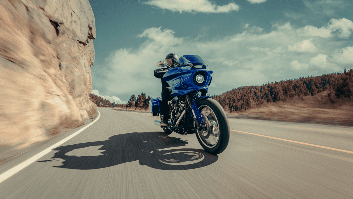 2025 Harley-Davidson® Low Rider® ST carving mountain curves near Deer Park, TX, highlighting its aggressive stance and West Coast style.