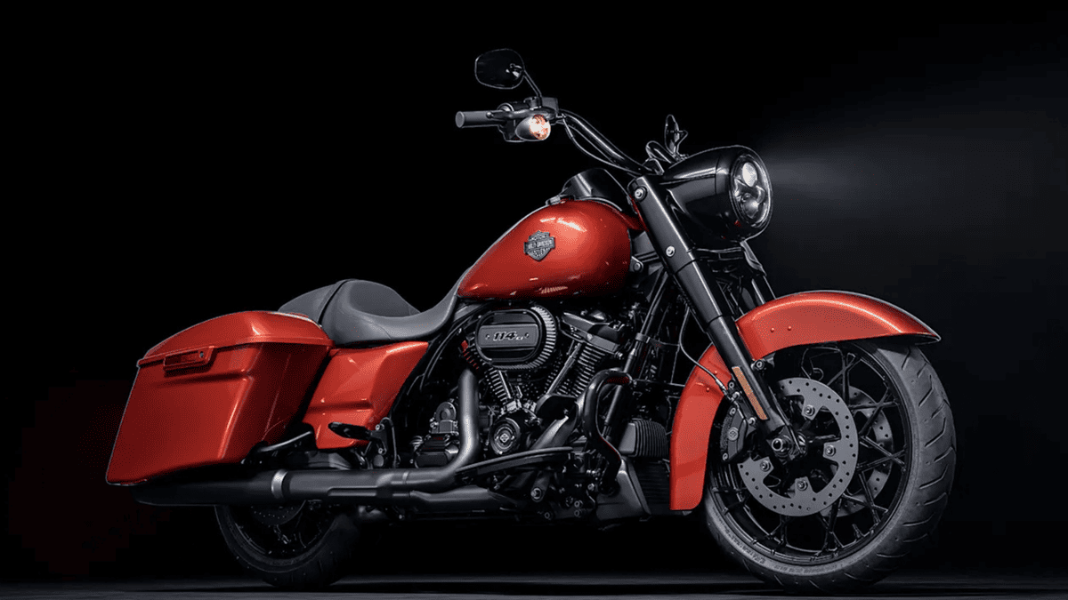 2025 Harley-Davidson® Road King® Special in red with blacked-out styling, spotlighted against a dark background near Deer Park, TX.