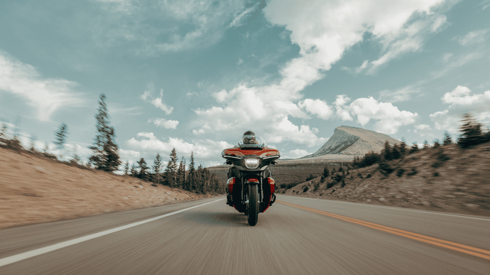 2025 Harley-Davidson® Street Glide® Ultra riding through scenic mountain road, built for long-distance touring near Friendswood, TX.