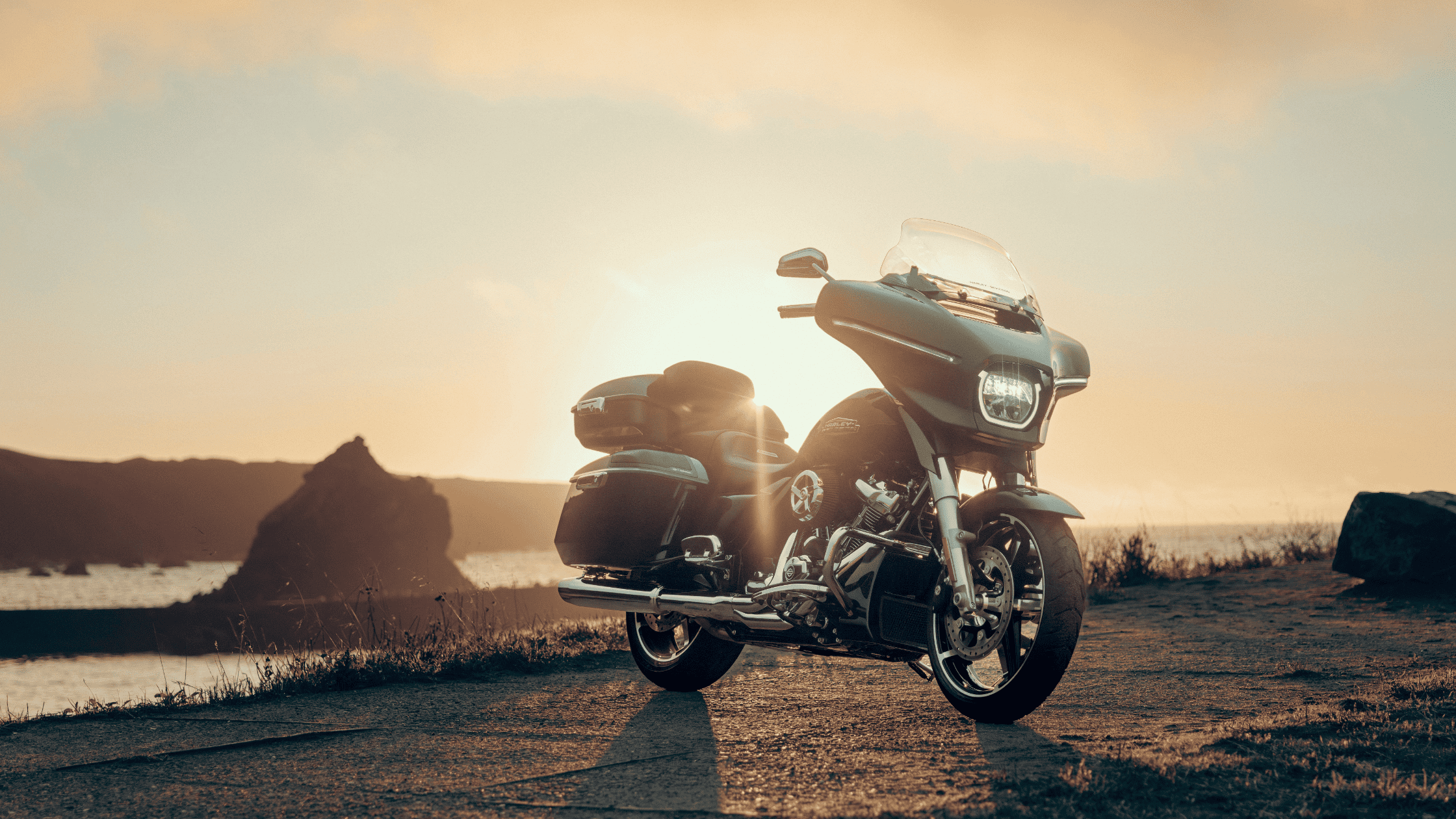 A 2024 Harley-Davidson® Street Glide® parked on a road, emphasizing its modern design and motorcycle culture.