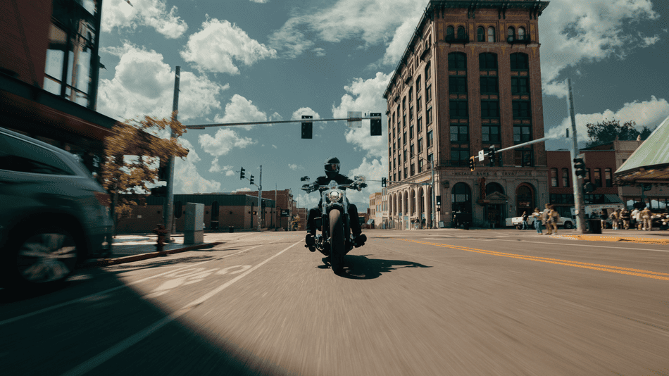 2025 Harley-Davidson® Breakout® navigating city streets in Deer Park, TX, with aggressive styling ideal for first-time buyers and custom fans.